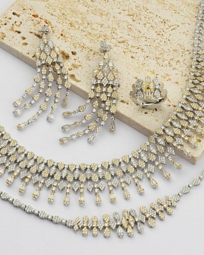 طقم نسائي زركون جذاب بلون فضي وذهبي