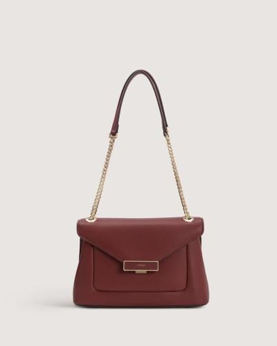 شنطة نسائية بحجم متوسط بلون عودي