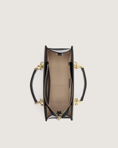 شنطة نمق النسائية من الجلد بلون أسود