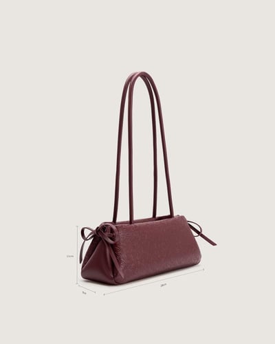 شنطة تعزز هويتك باللون العودي