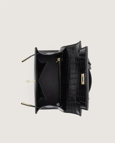 شنطة هدى النسائية جلد بلون أسود