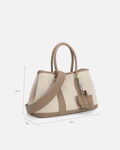 ‎ شنطة نسائية من القماش والجلد بلون بيج
