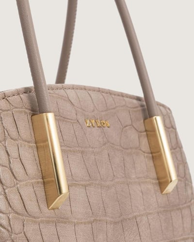 شنطة مزايا النسائية باللون البيج