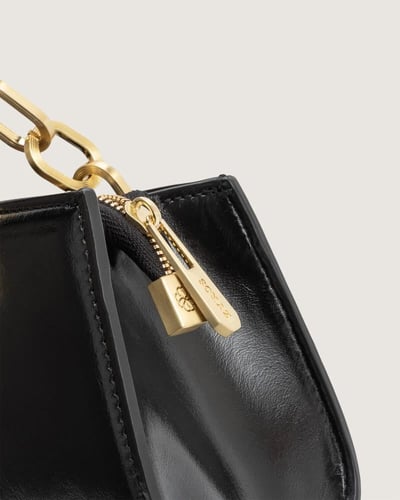 شنطة نمق النسائية من الجلد بلون أسود