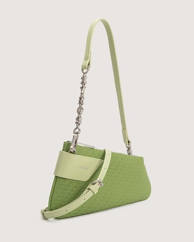 شنطة نسائية متوسطة الحجم بلون أخضر.