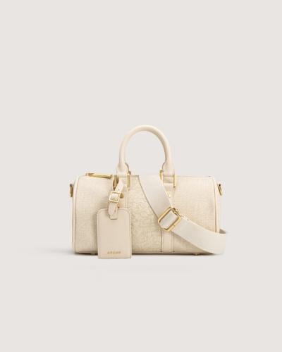 شنطة للجنسين عملية بلون بيج