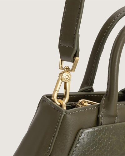 شنطة برواز النسائية باللون الزيتي