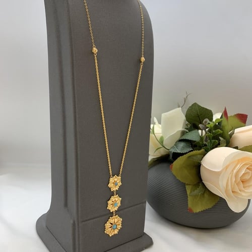 نص طقم بحريني عيار 21 باللون الفيروزي الوزن 10.4