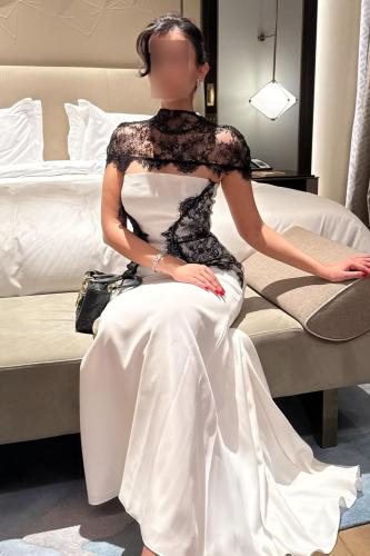 White evening dress with black lace.