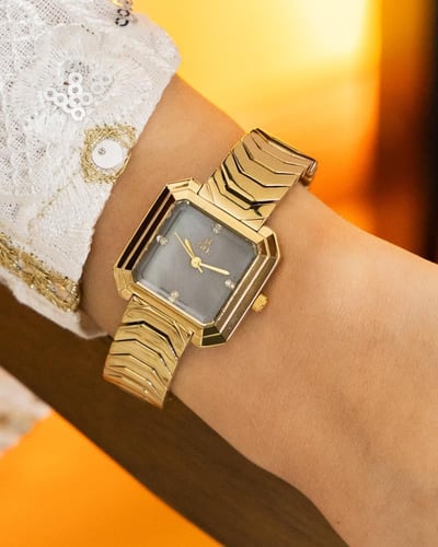 ساعه استيل باللون الذهبي رصاصي