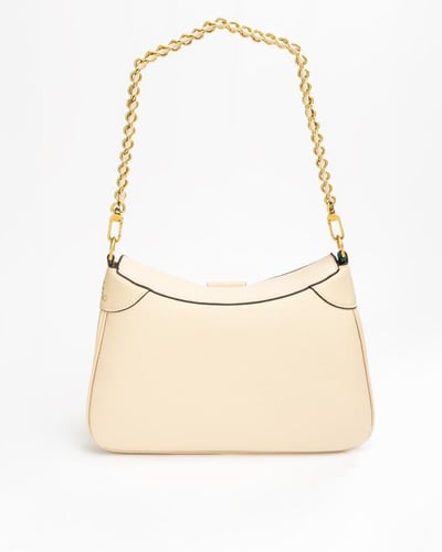 شنطة باللون البيج حجم وسط