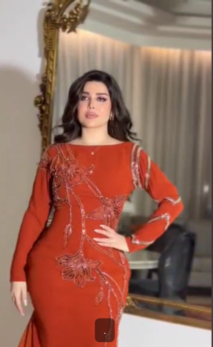 فستان سهرة اللون برتقالي نوع القماش باربي تطريز يد...