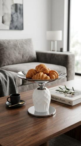 Luxury dessert and fruit serving tray with a raised base, featuring an elegant modern design for hospitality decor and tables