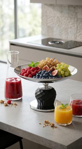 Luxury dessert and fruit serving tray with a raised base, featuring an elegant modern design for hospitality decor and tables