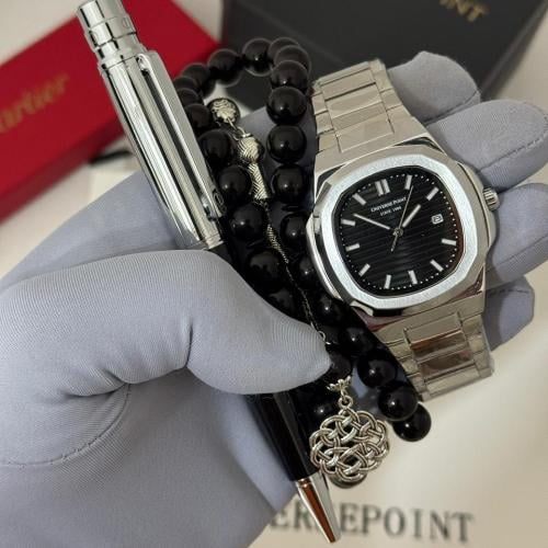 ساعة يدuniverse وقلم وسبحه