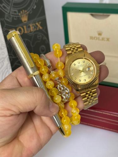 ساعة يد وقلم وسبحه