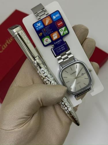 ساعة يد وقلم