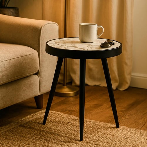 طاولة شاي دائرية أنيقة بتصميم عصري وأرجل متينة.