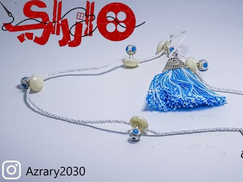 تركيبات عظم من ازراري باللون الفيروزي