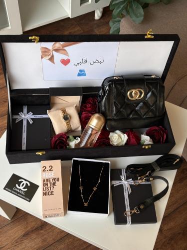 Luxury women's gift box with bag, perfume, and watch