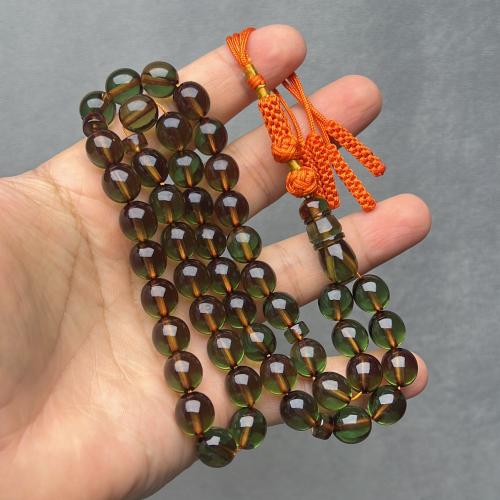 Saffron-colored prayer beads