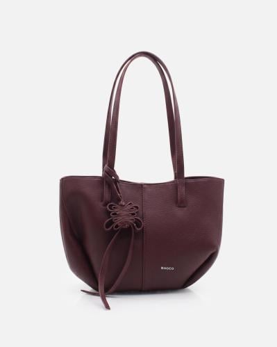 Women's burgundy shoulder bag with a soft design and leather charm