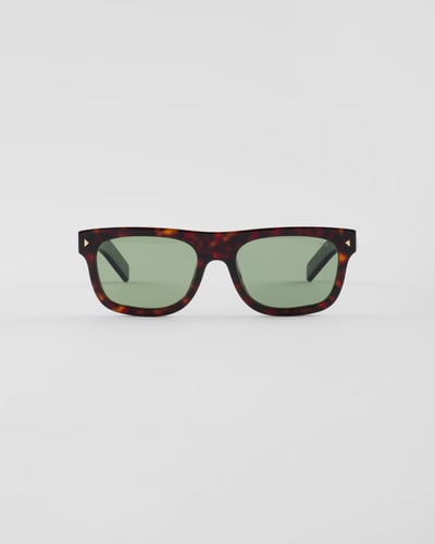 PRADA Sunglasses with the iconic metal plaque