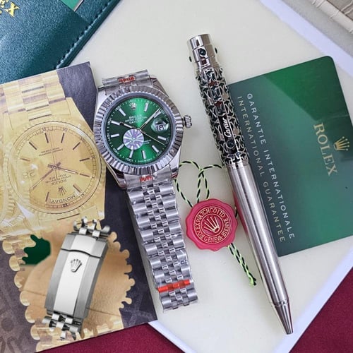 طقم ساعة رولكس اخضر مع قلم كارتير نحيف فضي