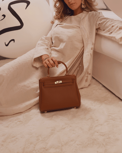 شنطة نسائية من الجلد بلون بني