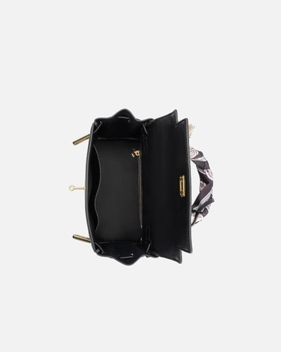 شنطة نسائية من الجلد بلون أسود