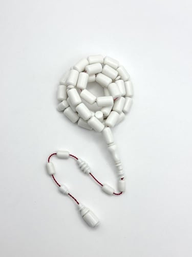 سبحة ضومنة أبيض كبسولة