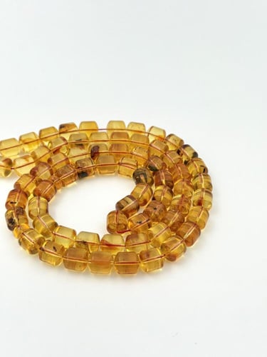 سبحة كهرمان طبيعي عسلي شفاف صندوقي