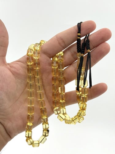 سبحة كهرمان طبيعي شفاف صندوقي