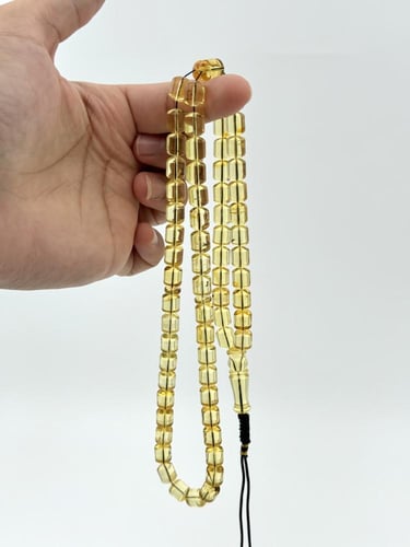 سبحة كهرمان طبيعي شفاف صندوقي