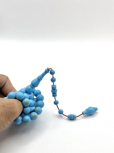 سبحة بكلايت أزرق فاتح بعروق ذهبية