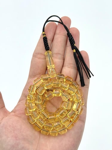 سبحة كهرمان طبيعي شفاف صندوقي