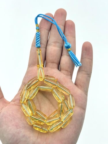 سبحة كهرمان طبيعي شفاف صنوبري