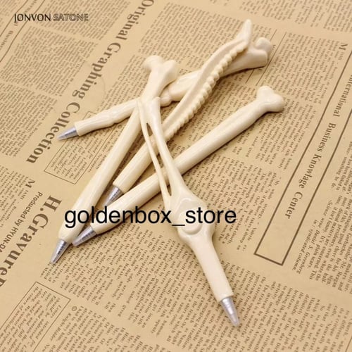 قلم على شكل عظام مع كرت