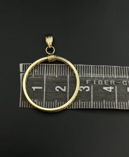 تعليقة عيار18. شكل دائري. الوزن 1 جرام