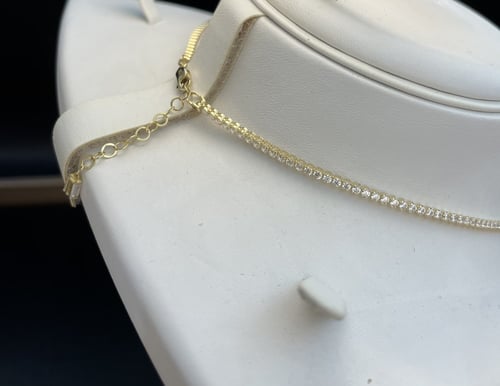 تنس نص طقم (تشوكر وحلق و خاتم) عيار 18. الوزن 9.8...