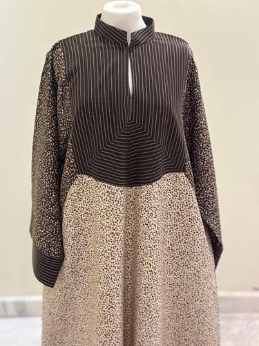 جلابية بني منقط