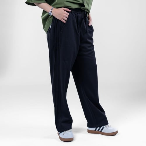 بنطلون ترنج سادة بتصميم مريح وجيوب جانبيه بخصر مطا...