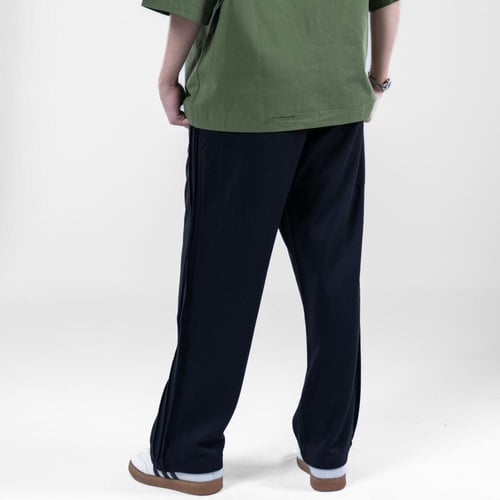 بنطلون ترنج سادة بتصميم مريح وجيوب جانبيه بخصر مطا...