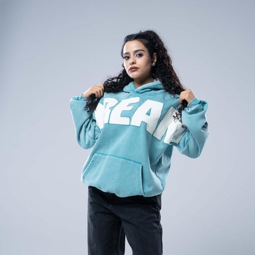 هودي أوفرسايز بقبعة وتطريز حروف كبيرة وستايل مغسول...