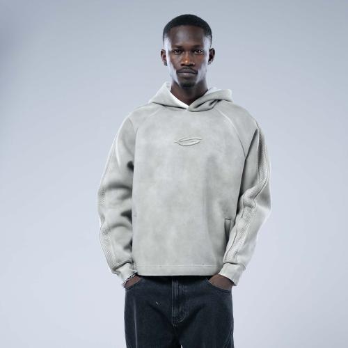 هودي أوفرسايز بقصة ريجلان وشعار مطرز وتأثير مغسول...