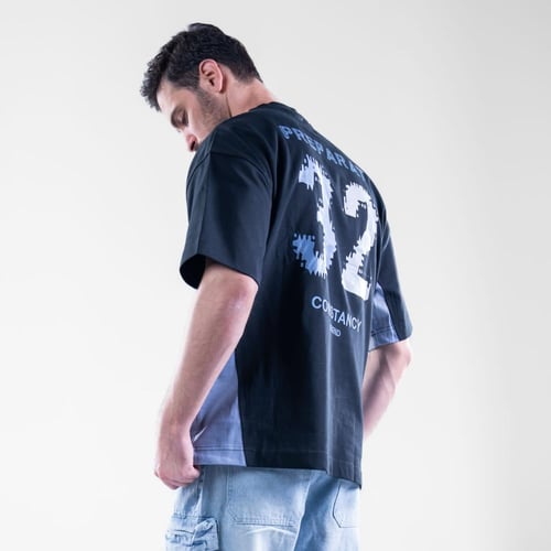 تيشيرت اوفر سايز نص كم بكتابة اماميه وخطوط منحنيه...