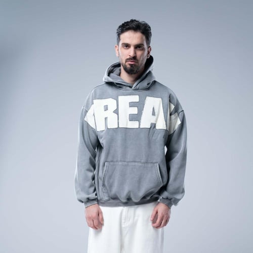 هودي أوفرسايز بقبعة وتطريز حروف كبيرة وستايل مغسول...