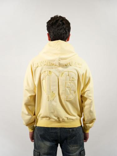 هودي بتطريز بارز وجيوب امامية - اصفر فاتح