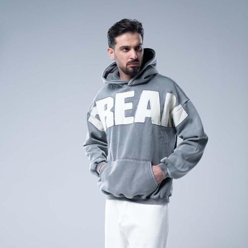 هودي أوفرسايز بقبعة وتطريز حروف كبيرة وستايل مغسول...