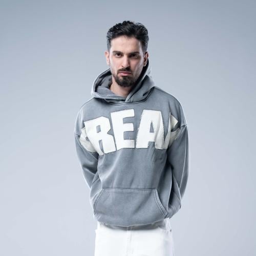 هودي أوفرسايز بقبعة وتطريز حروف كبيرة وستايل مغسول...